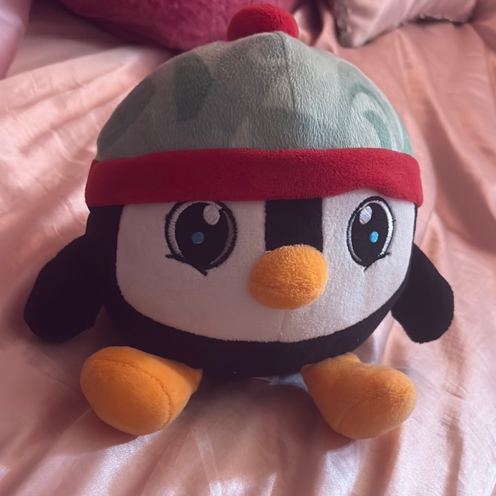 Plush Penguin Toy with Red and Black Accents